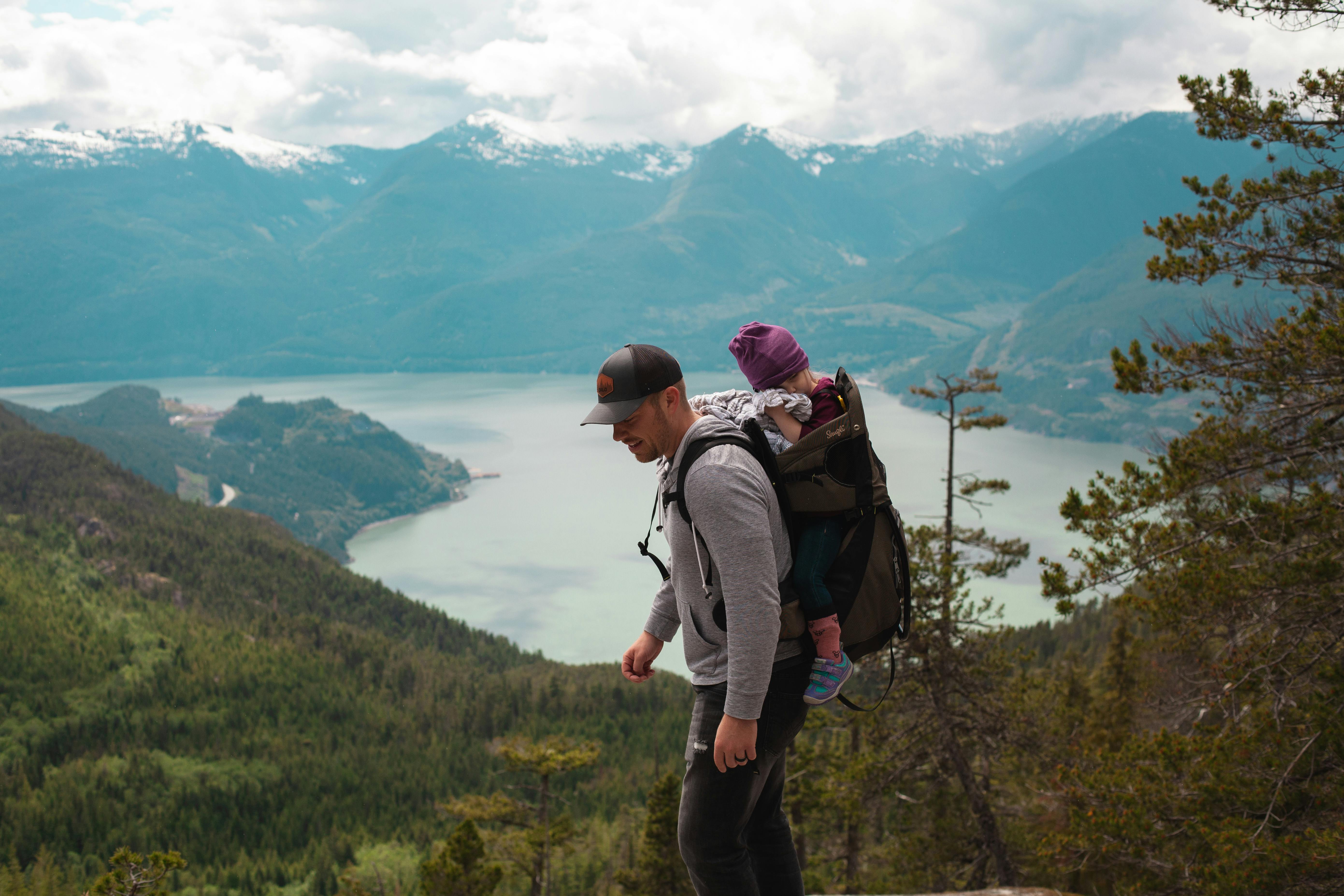 Dad hiking with baby in carrier pack
